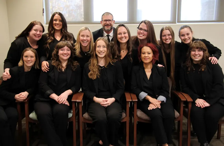 Members of the Sala team seated together in the waiting room.