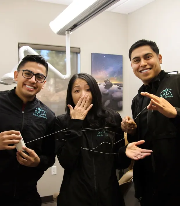 Three of the team having fun in a treatment room.